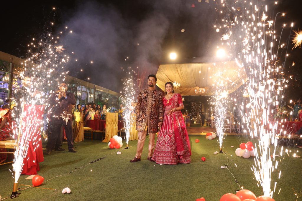 Couple celebrating their wedding beneath sparklers